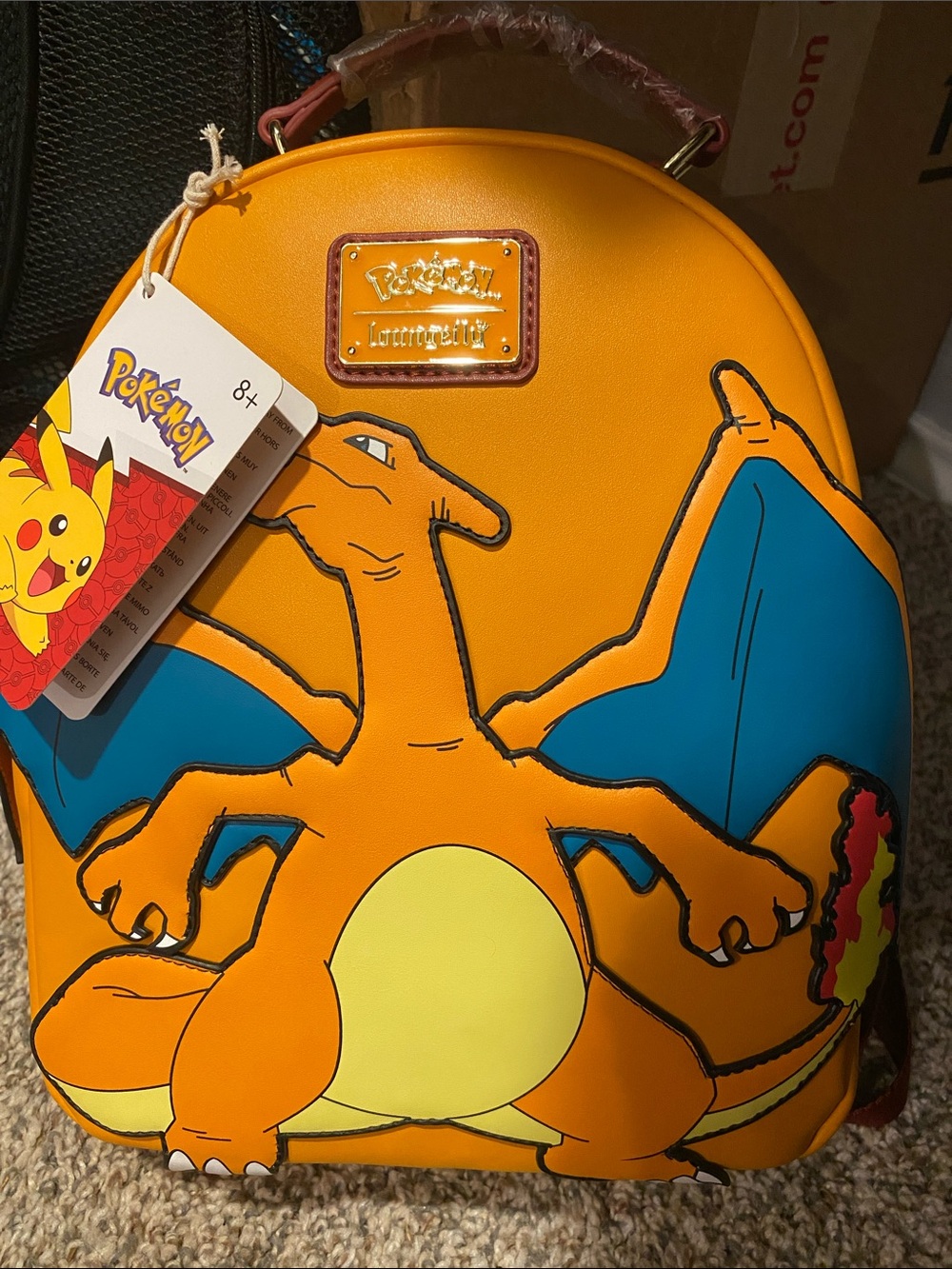 Loungefly Orange Charizard Mini Backpack with Blue Wings
